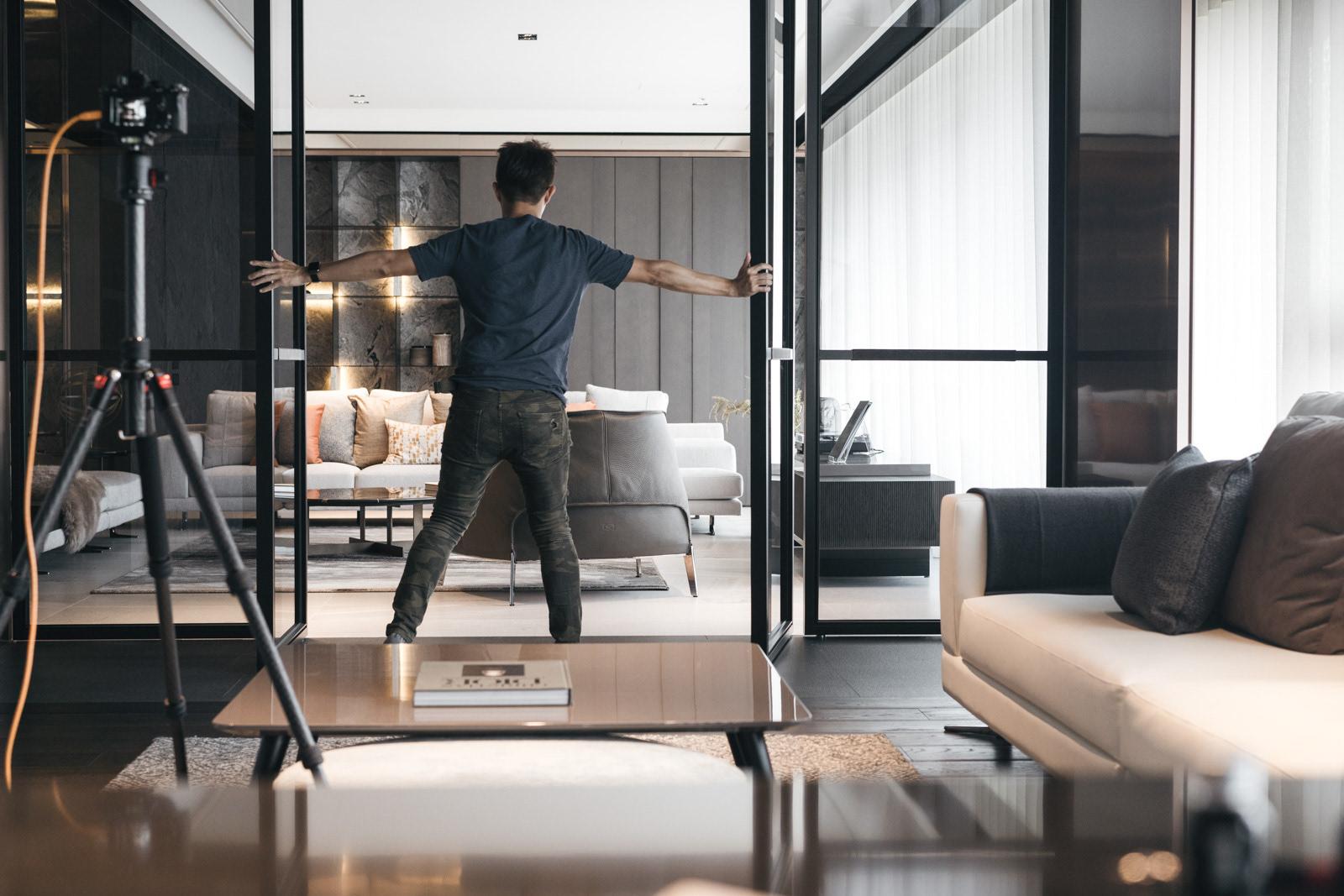 Real estate agent welcoming clients at the property door